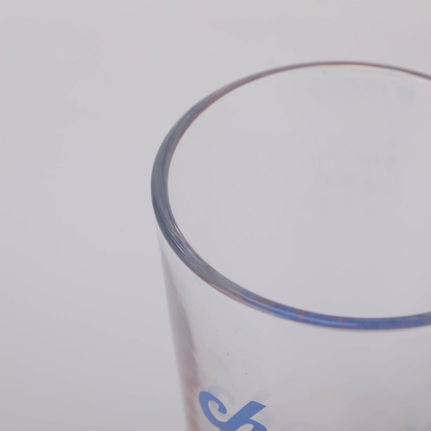 Red Bottom Glass Tumbler with Letters in Blue