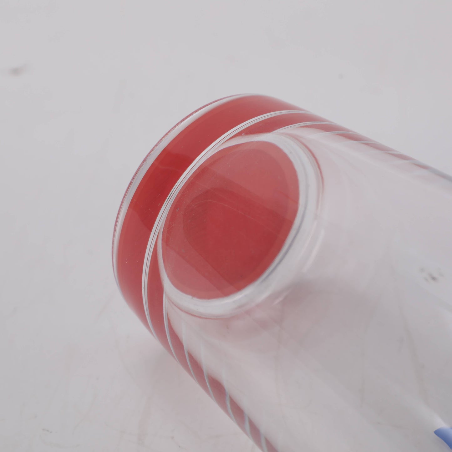 Red Bottom Glass Tumbler with Letters in Blue